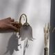 Flower wall lamp in glass and gold metal