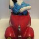 Dog toy driving his red car