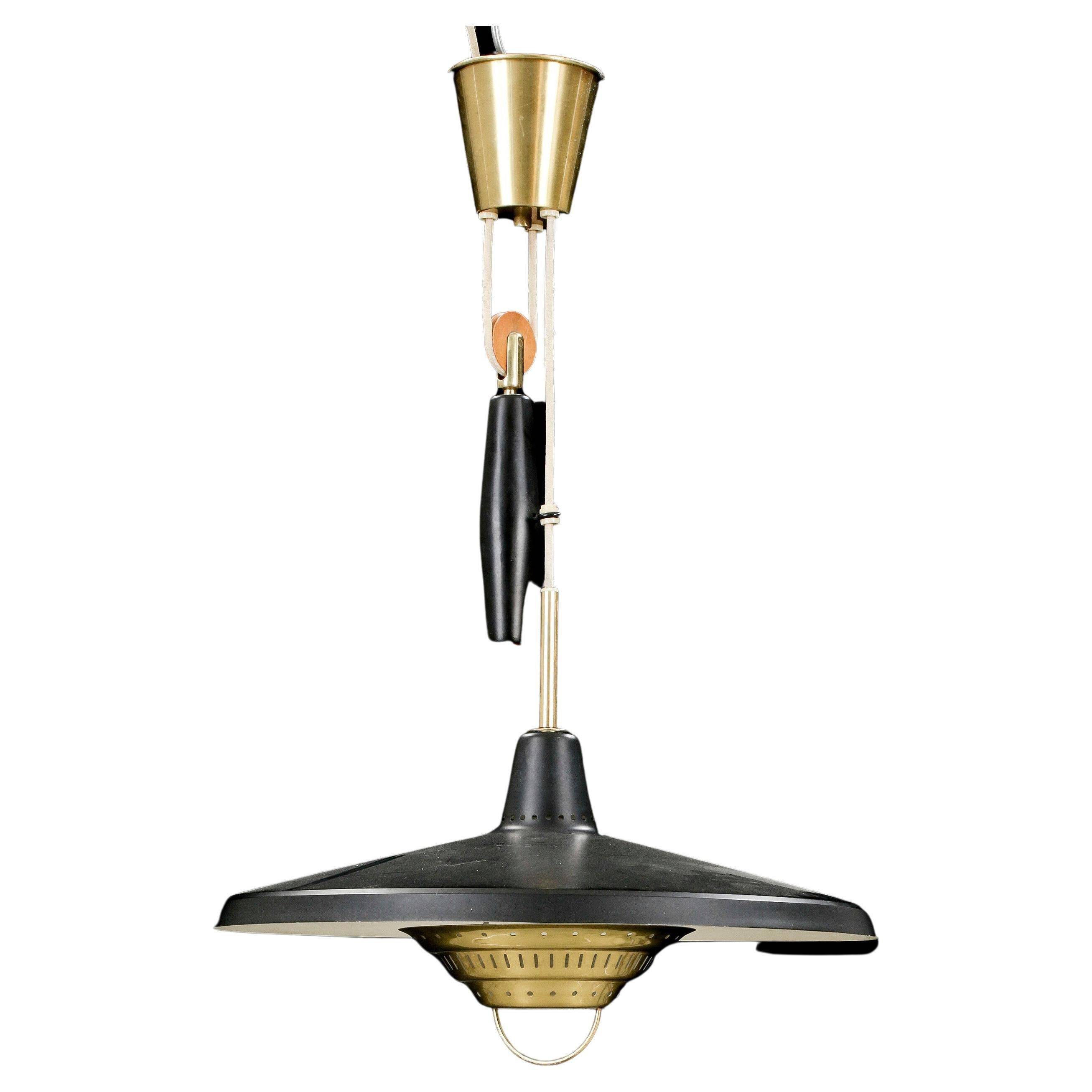 Anonymous suspended lamp with metal black and brass counterweight, Sweden, 1950.