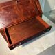 Antique mahogany secretary, upholstered flap and interior storage