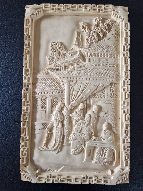 Sculpted resin plaque in the style of China.