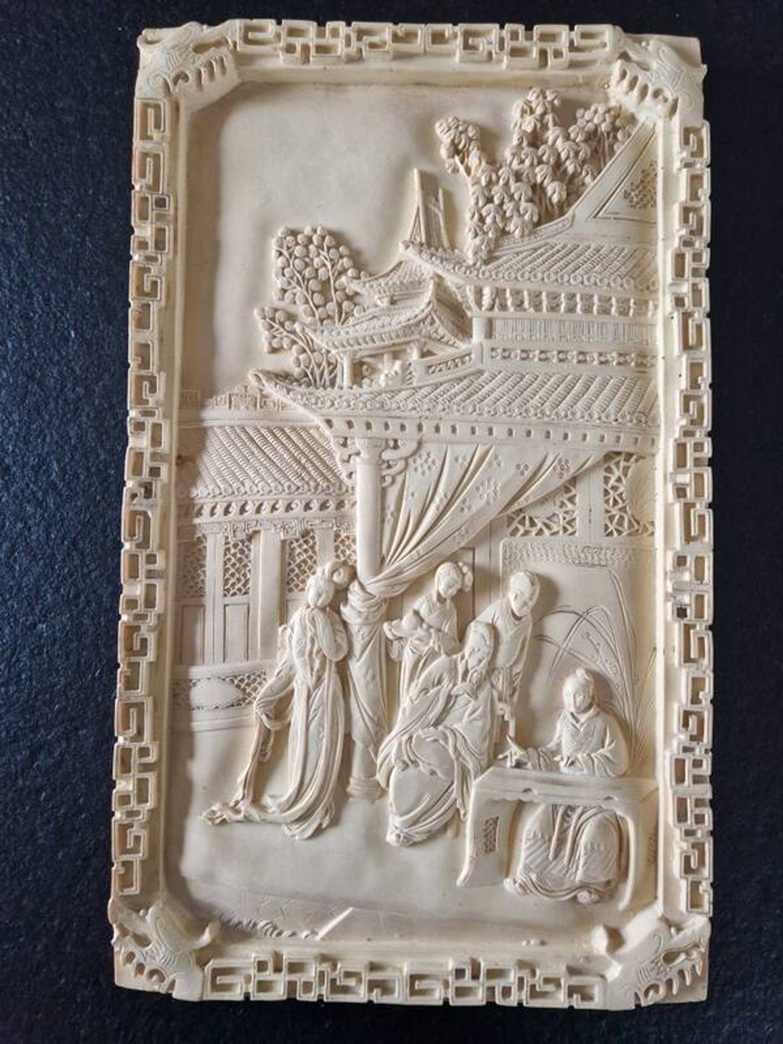 Sculpted resin plaque in the style of China.