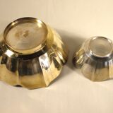 Two brass trundle cups