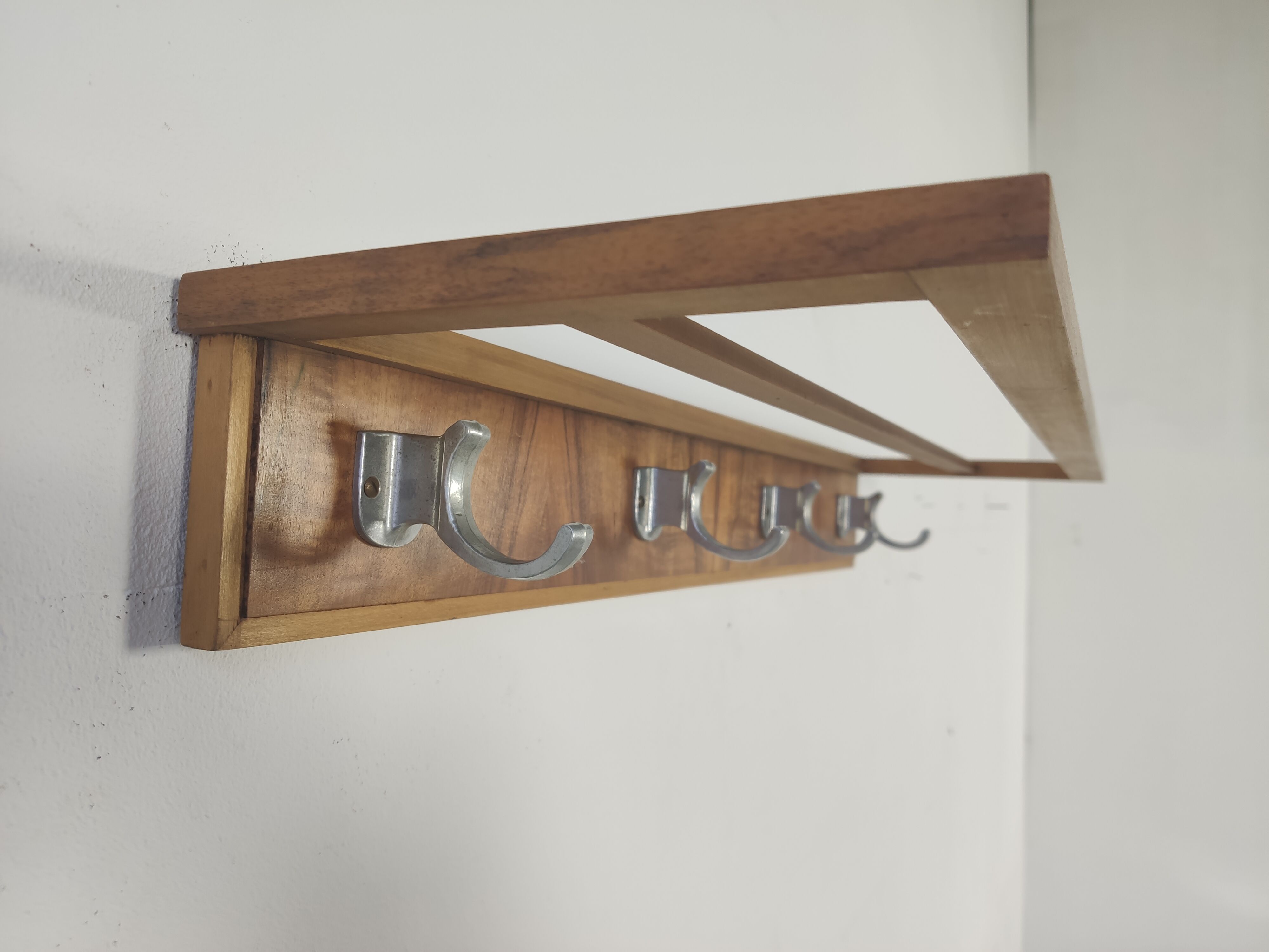 Walnut and metal wall coat rack, 1950s