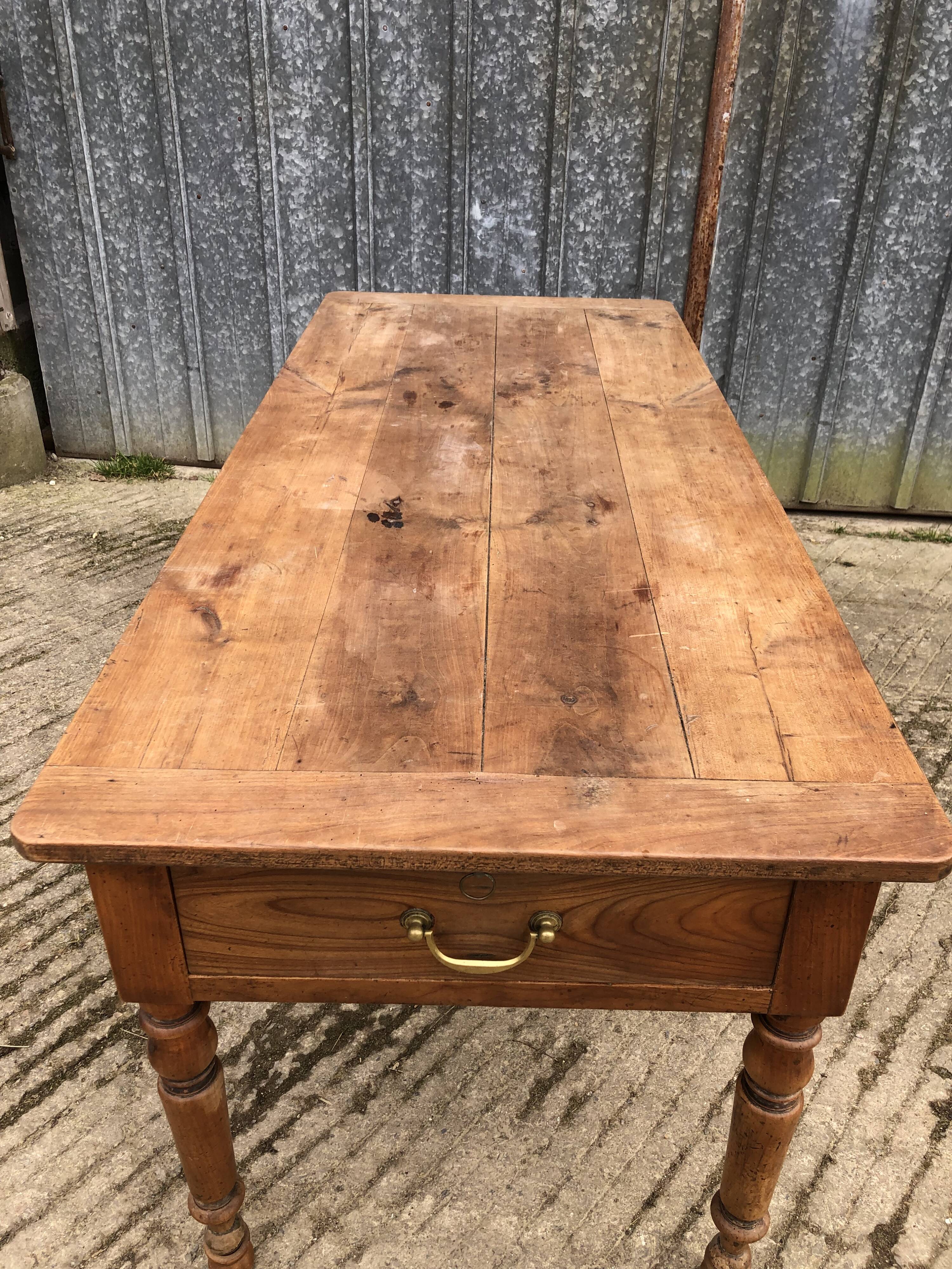 Antique cherry farmhouse table with 2 drawers and 1 pull-out