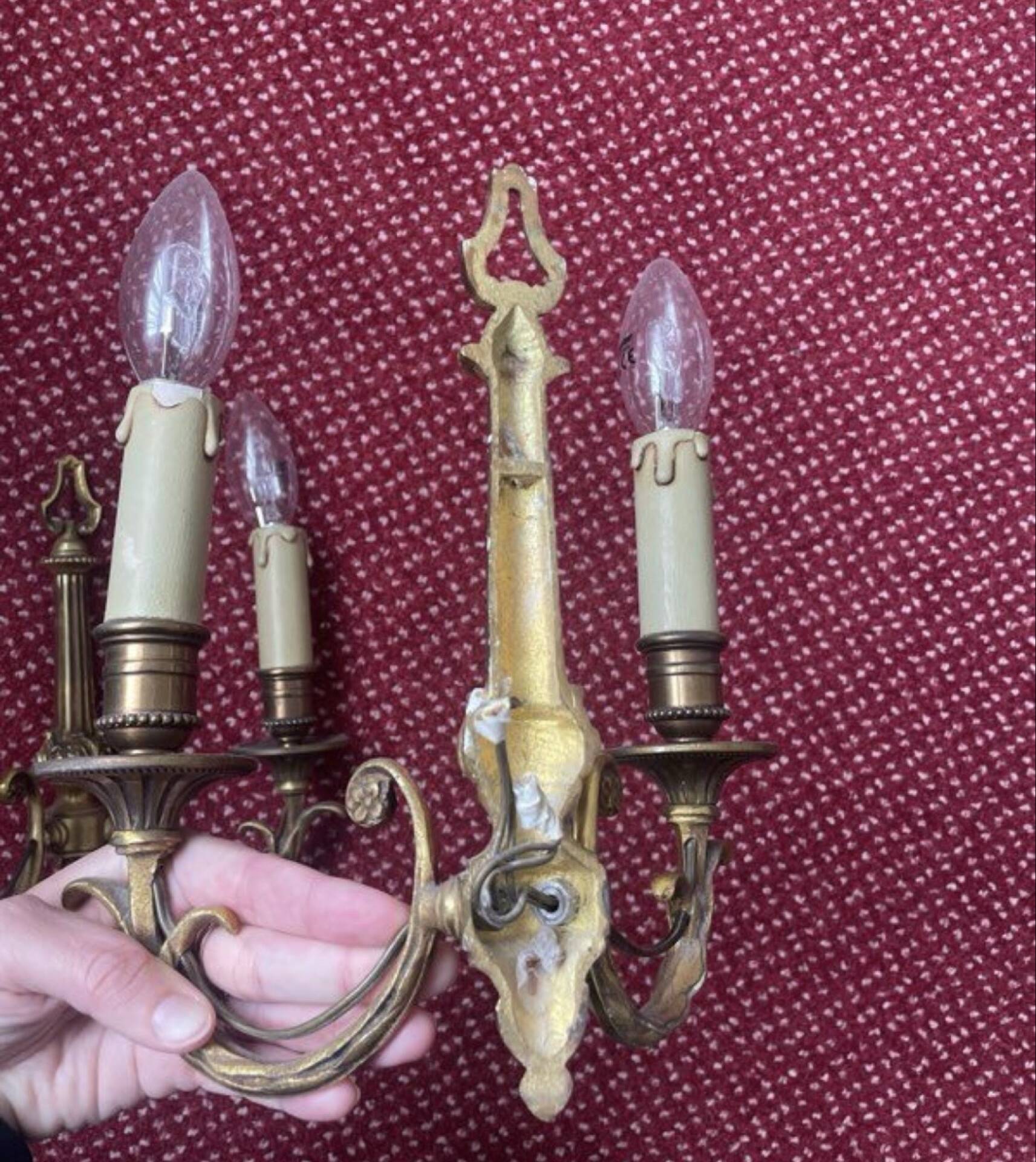 two brass wall sconces