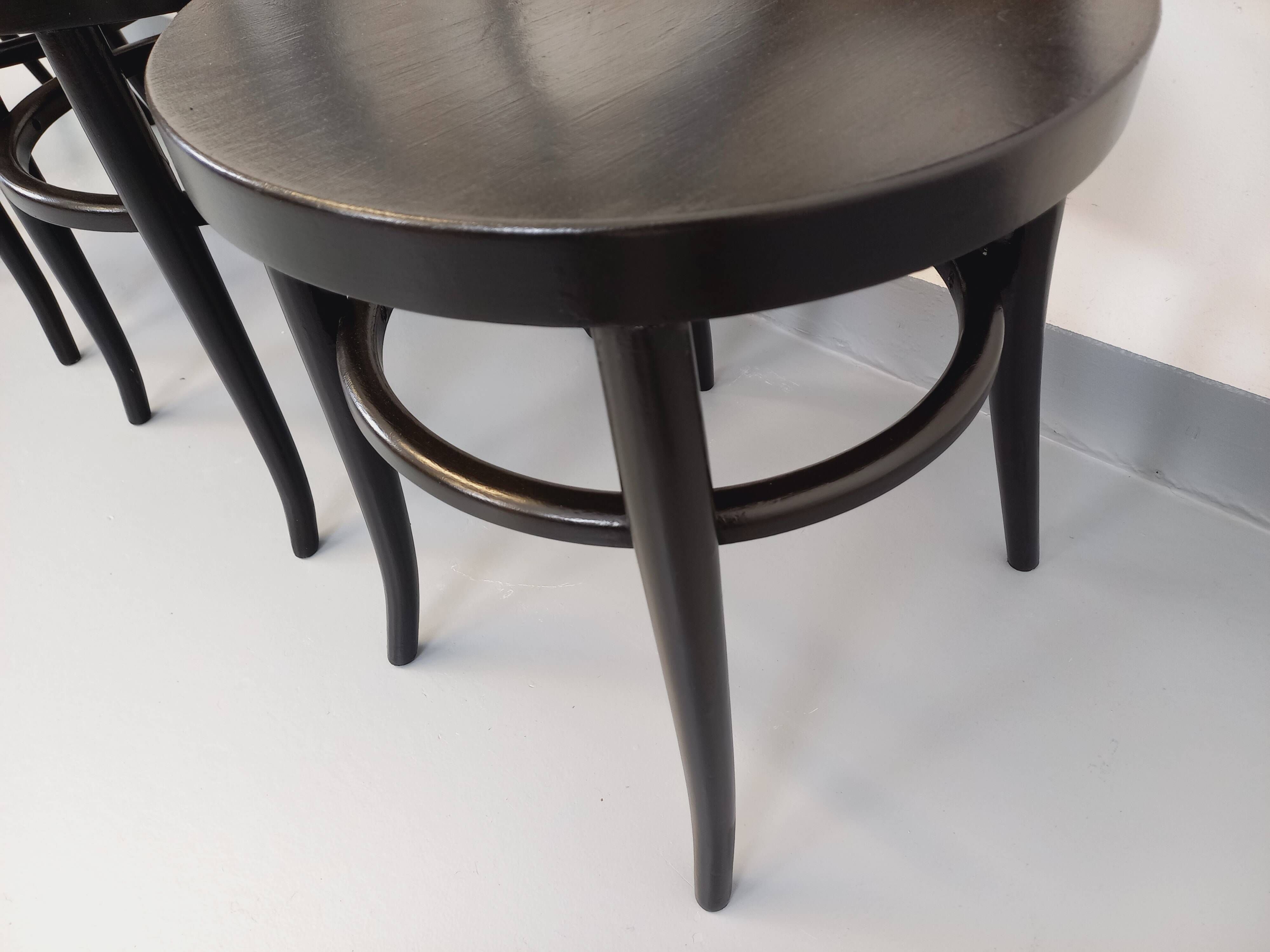 Set of 4 vintage Mouette chairs by Baumann in black wood from the 1960s.