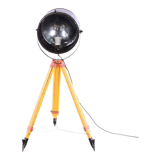 Old industrial spot on wooden tripod