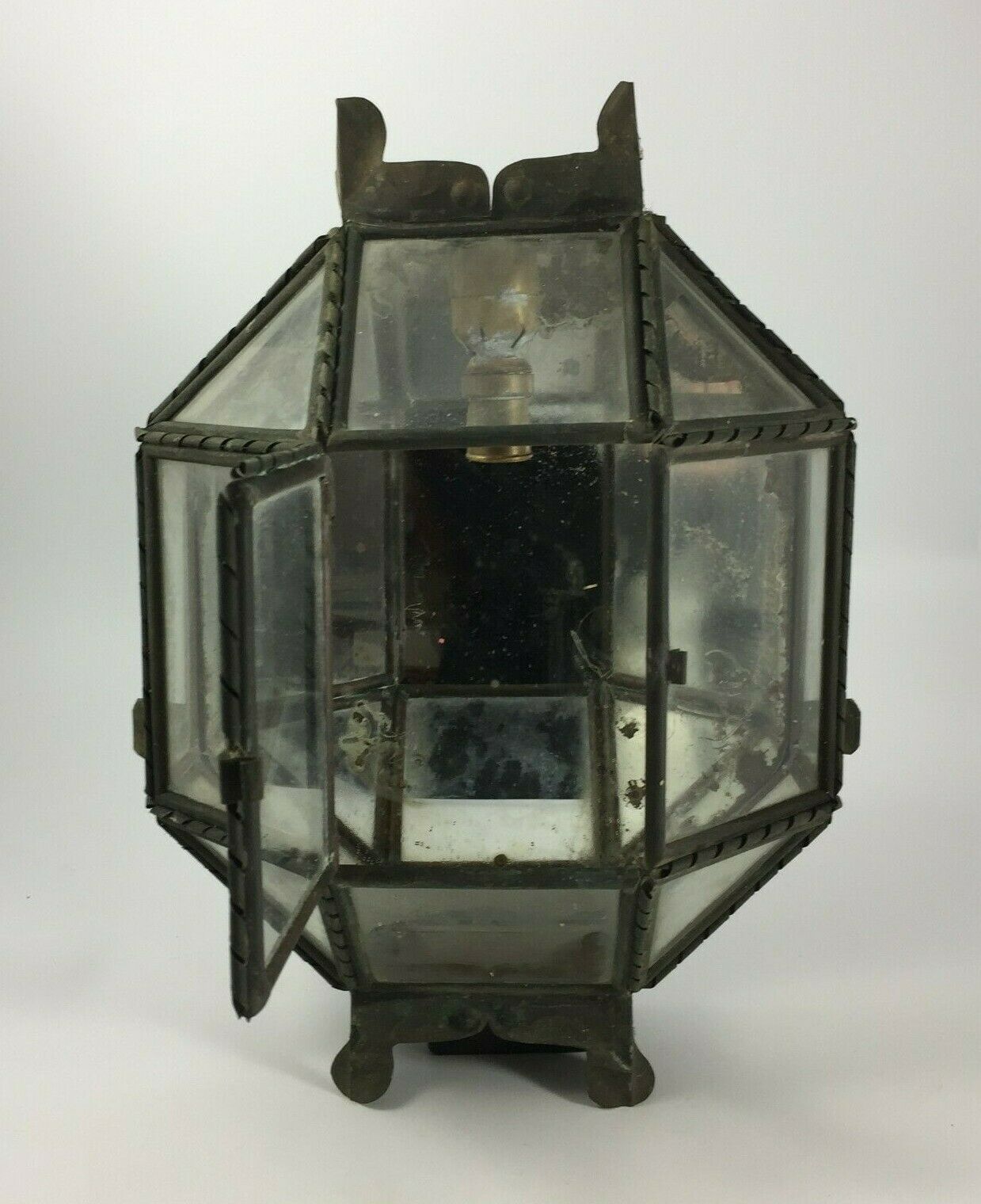 Metal and brass wall light with mirror background 1900