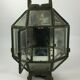 Metal and brass wall light with mirror background 1900