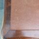 Louis XV style desk in wood, with a brown leather top.