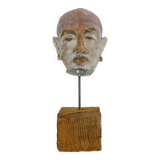 Face sculpture in polychrome earth and plaster, cabinet of curiosities. Ph Monaux. Ariège artist