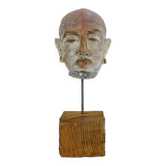Face sculpture in polychrome earth and plaster, cabinet of curiosities. Ph Monaux. Ariège artist