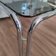 Table basse piètement chromé et plateau en verre fumé noir