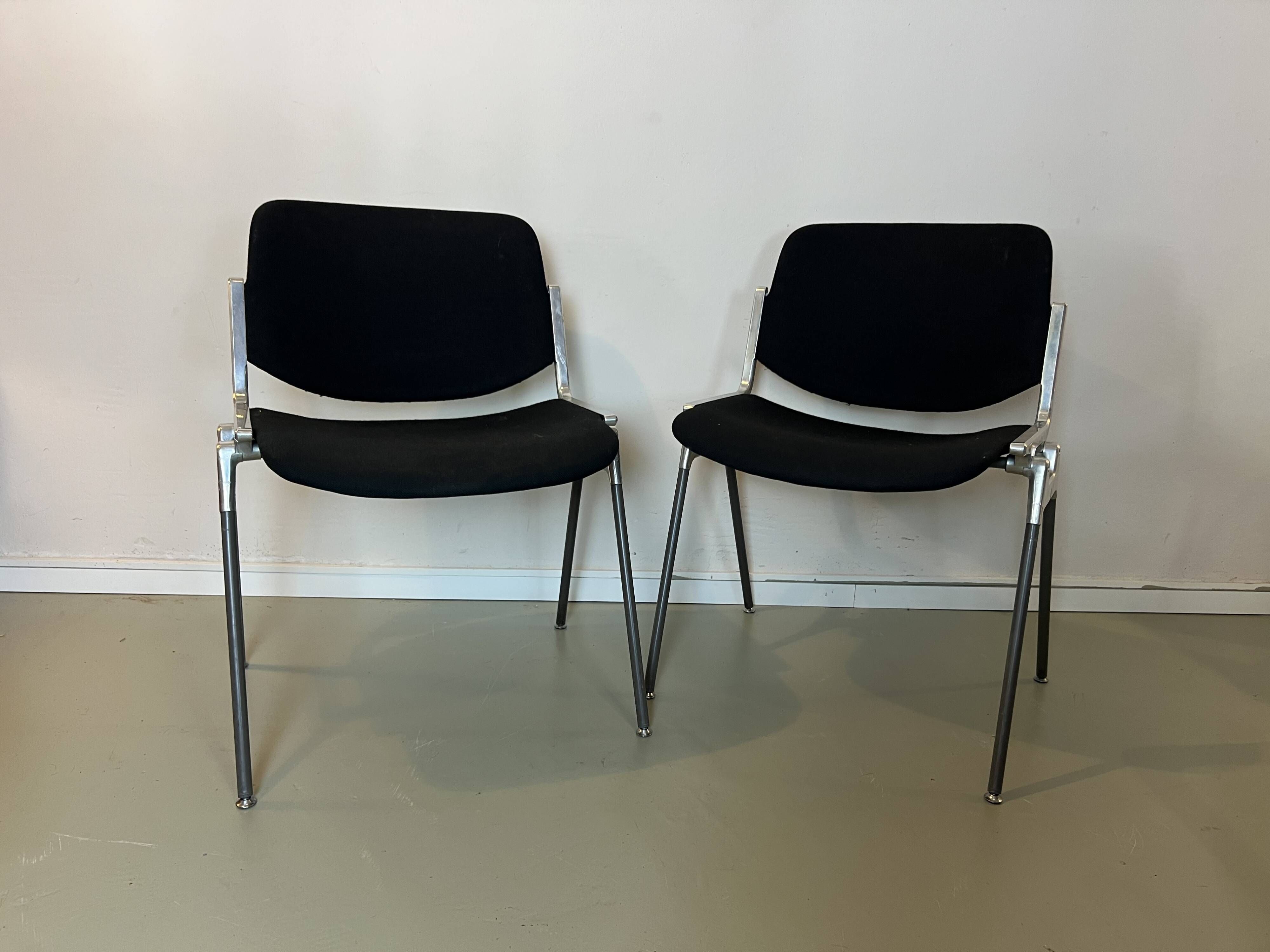 Black DSC chairs by Giancarlo Piretti for Castelli from the 60s/70s.