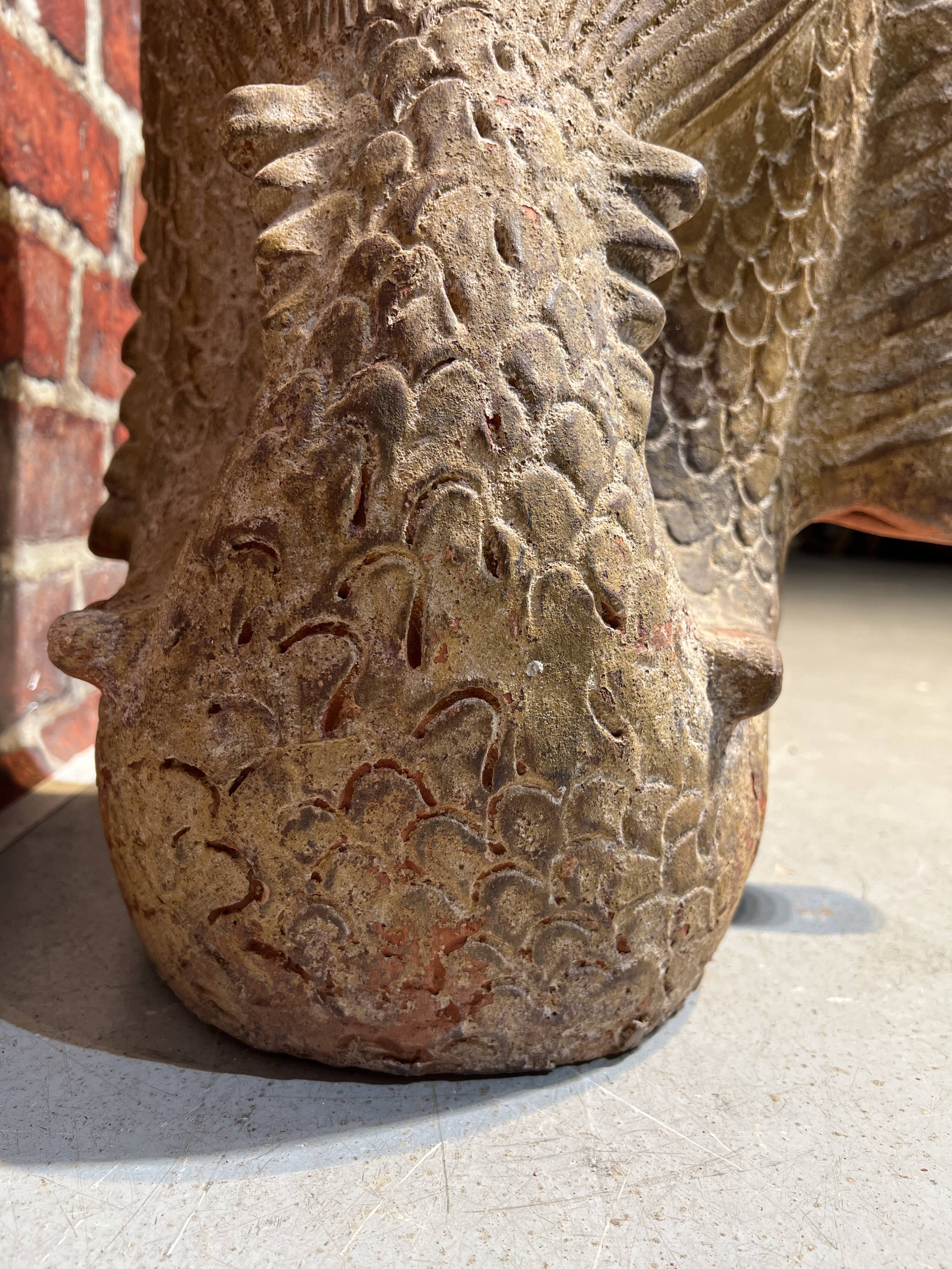 Terracotta umbrella stand in the shape of a fish