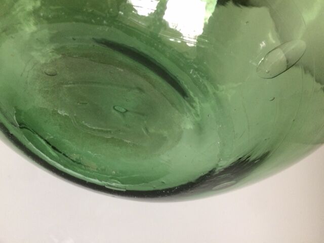 Demijohn old transparent green, estimated capacity around 12 to 15L