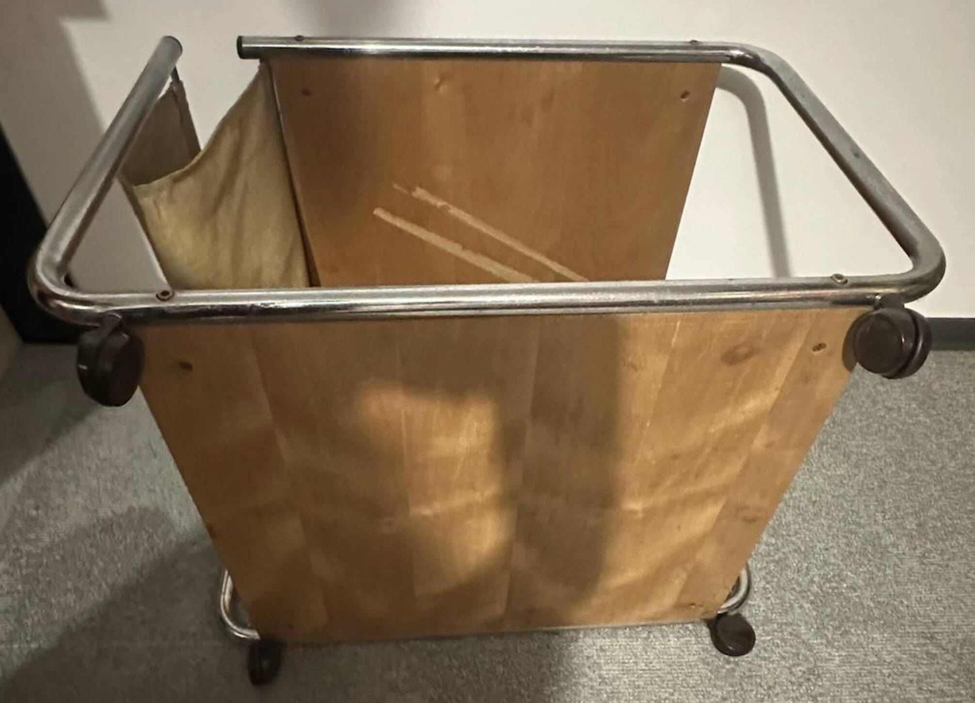 1970s/80s coffee table on casters with metal tubing, light-colored door