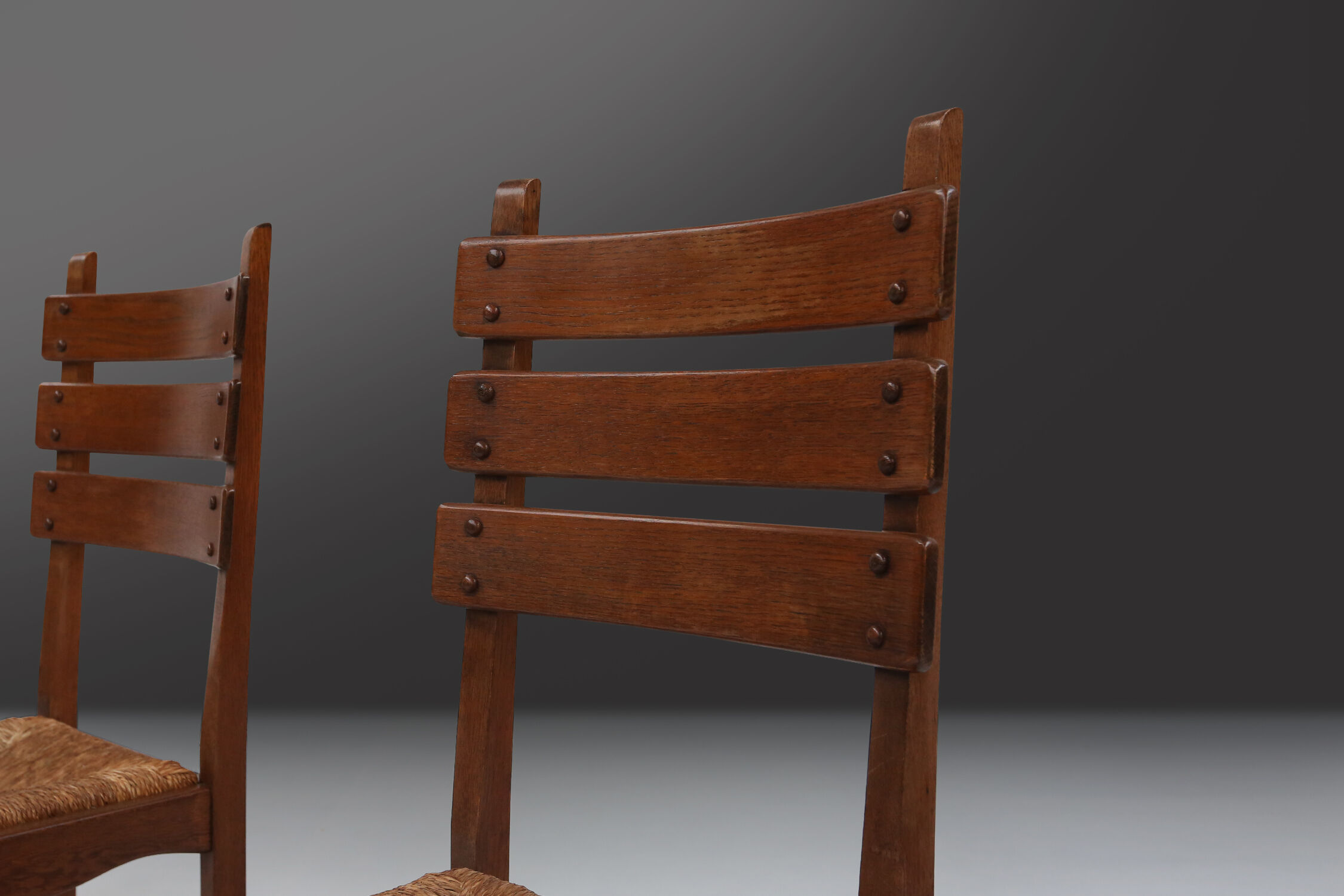 Set of six brutalist dining chairs in oak an wicker