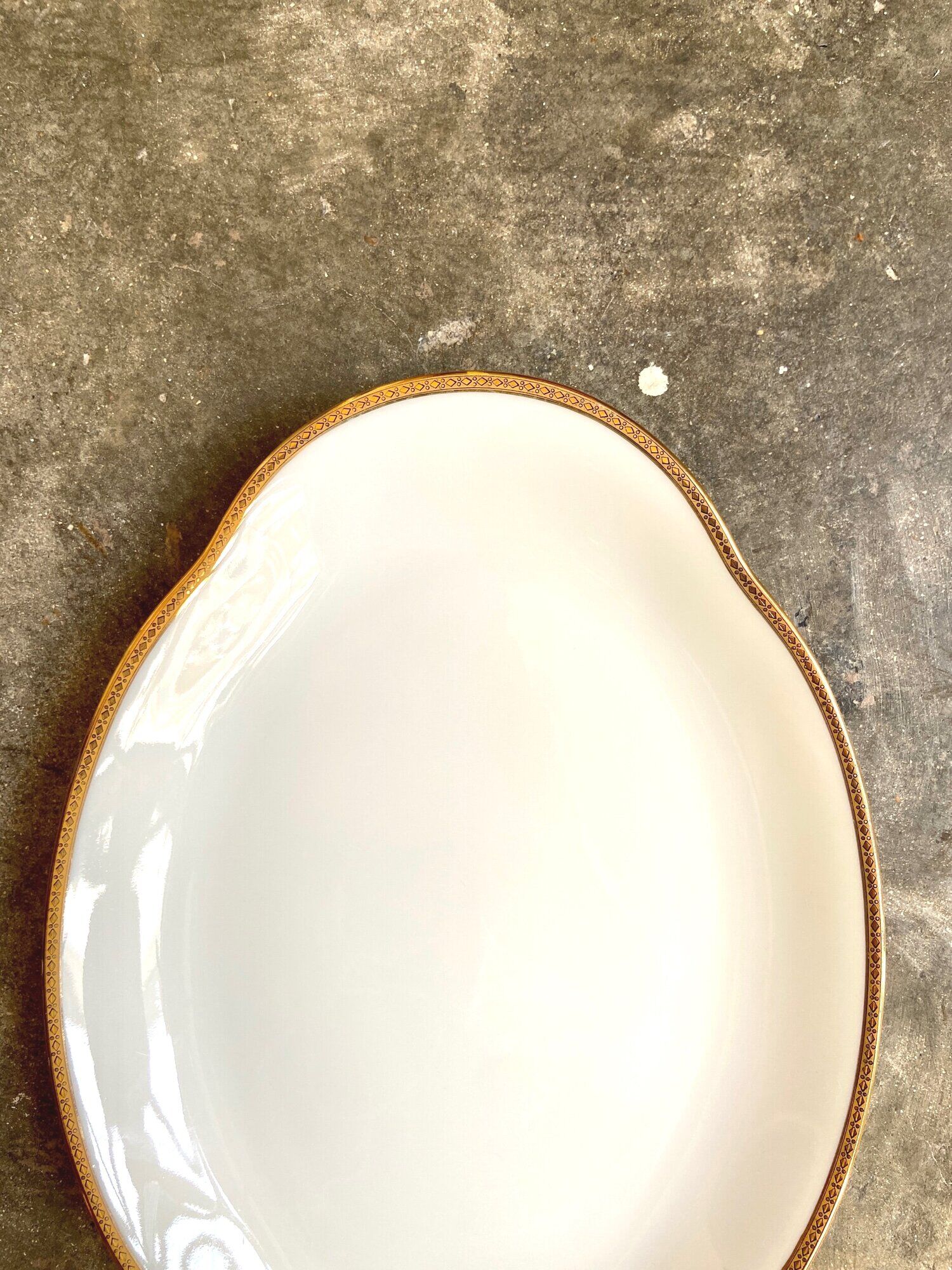 Oval dish in white and golden Limoges porcelain