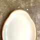 Oval dish in white and golden Limoges porcelain