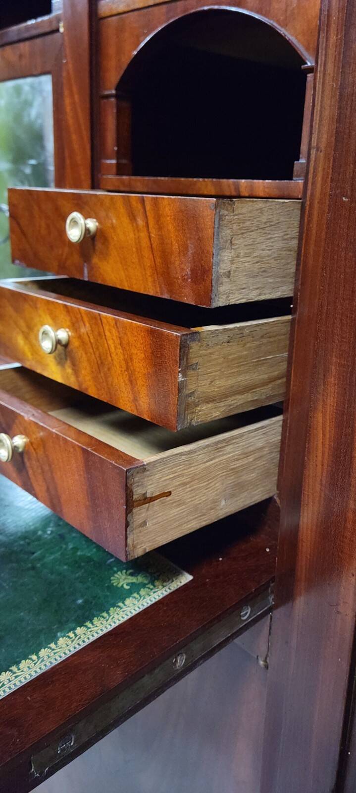 Rare four-column secretary from the Empire period in flame mahogany and bronze.