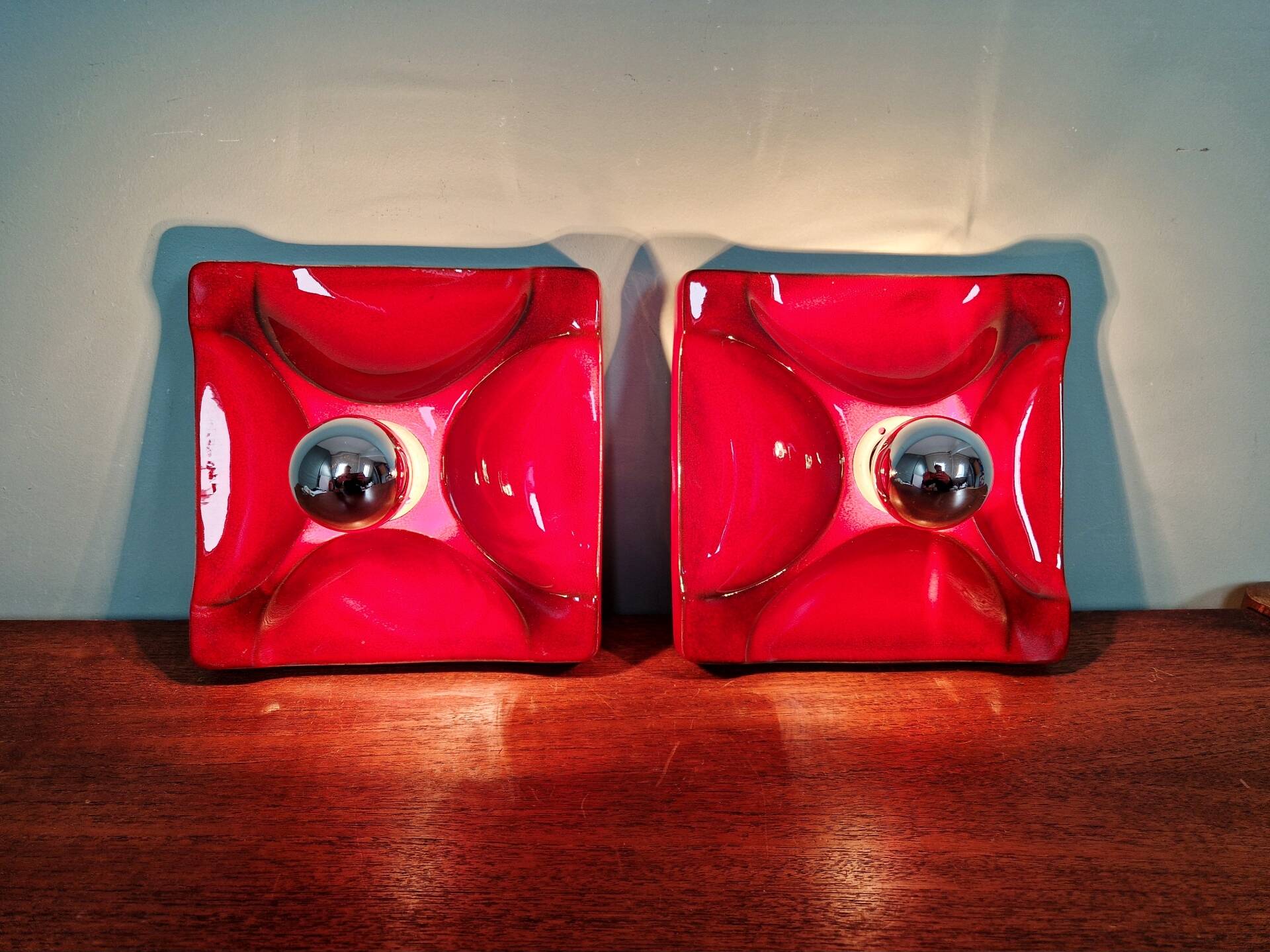 Pair of Space Age wall sconces in red ceramic, 1970.