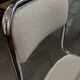 Pair of chrome chairs upholstered in boucle fabric.