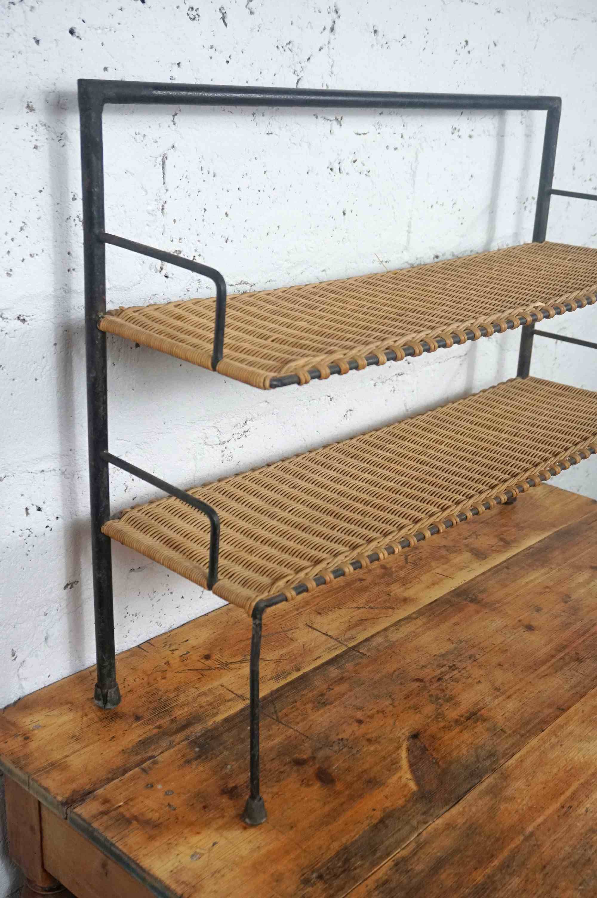 low metal and rattan shelf from the 50s