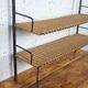 low metal and rattan shelf from the 50s