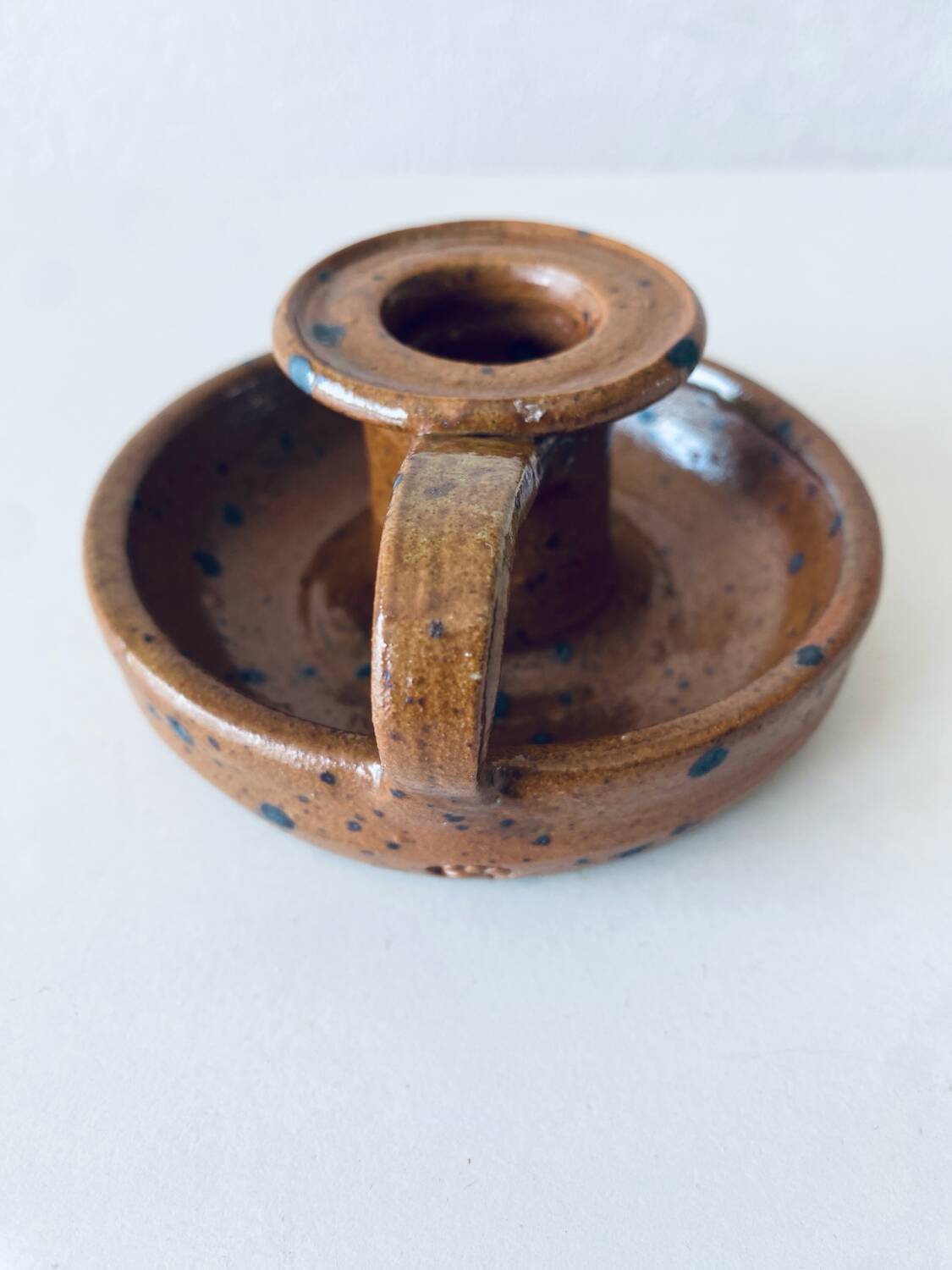 Signed sandstone candle holder