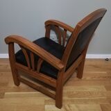 Colonial armchair in teak and black leather