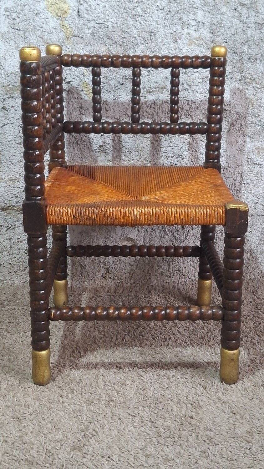 Fireplace corner chair in Louis XIII style, turned wood with braided rush, 19th century.