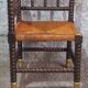 Fireplace corner chair in Louis XIII style, turned wood with braided rush, 19th century.