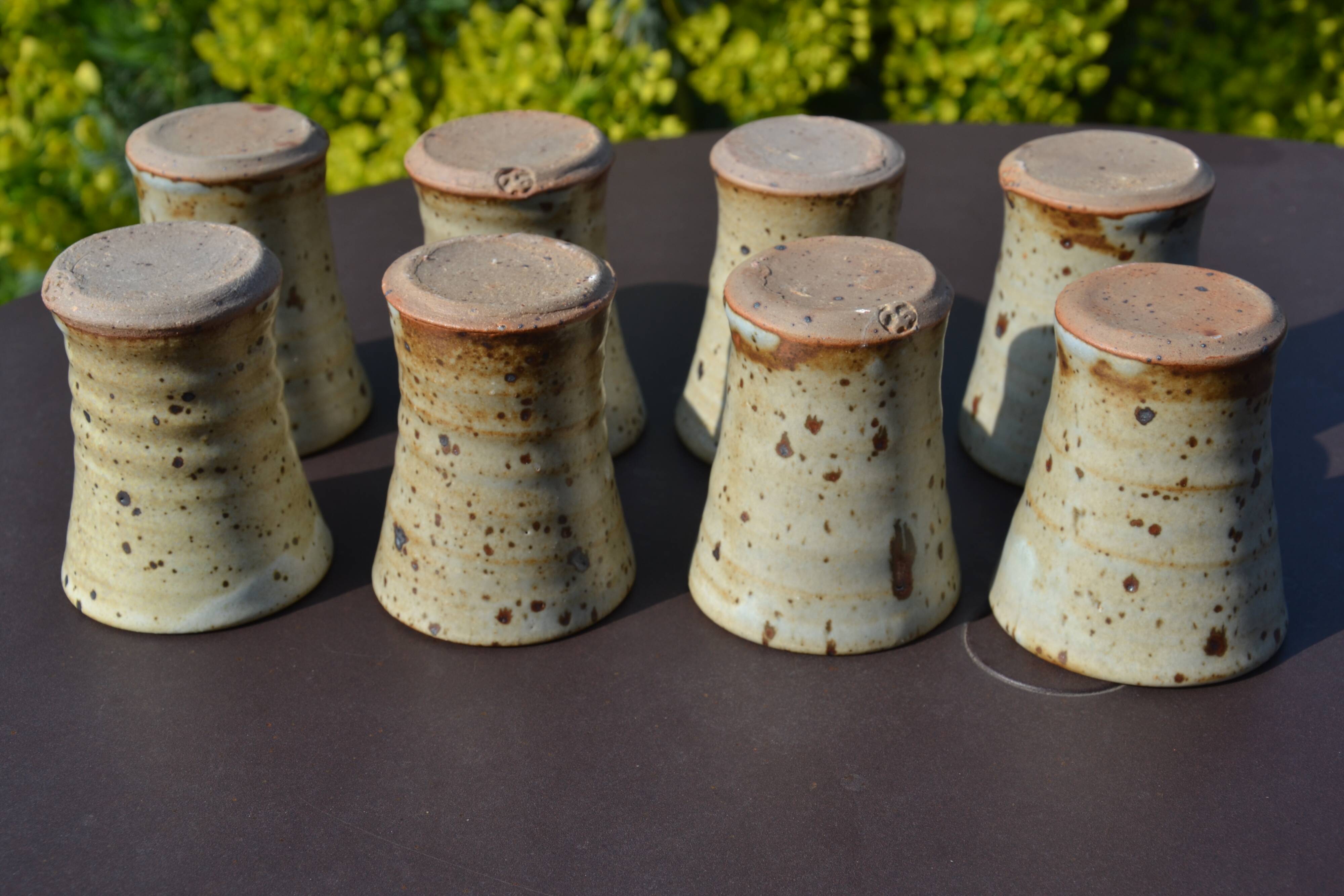 8 stoneware cups/mugs by Gustave Tiffoche