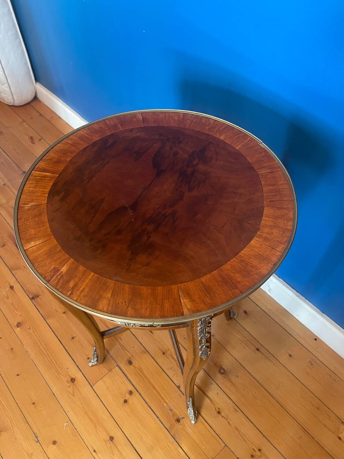High wooden pedestal table