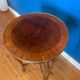 High wooden pedestal table
