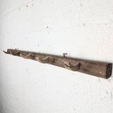 Handcrafted wall coat rack in raw wood