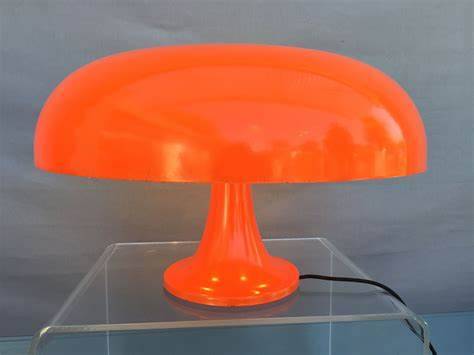 Nessino Table lamp in orange plastic / Ø 32 cm - Reissue from the 1960s - Artemide