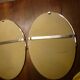 2 bathroom mirrors in silver oval holders