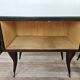 Mid-century mahogany bedside tables with mirrored tops.
