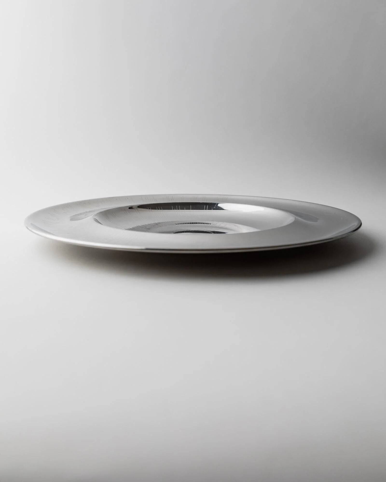 Vintage stainless steel bowl from the 1980s, polished metal with a finely textured surface, timeless elegant design, retro table decoration, noble gift idea.