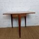Folding three-legged game or side table from the 1960s, space-saving.