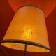 Vintage 1960s floor lamp with black tripod base and round varnished wooden shelf