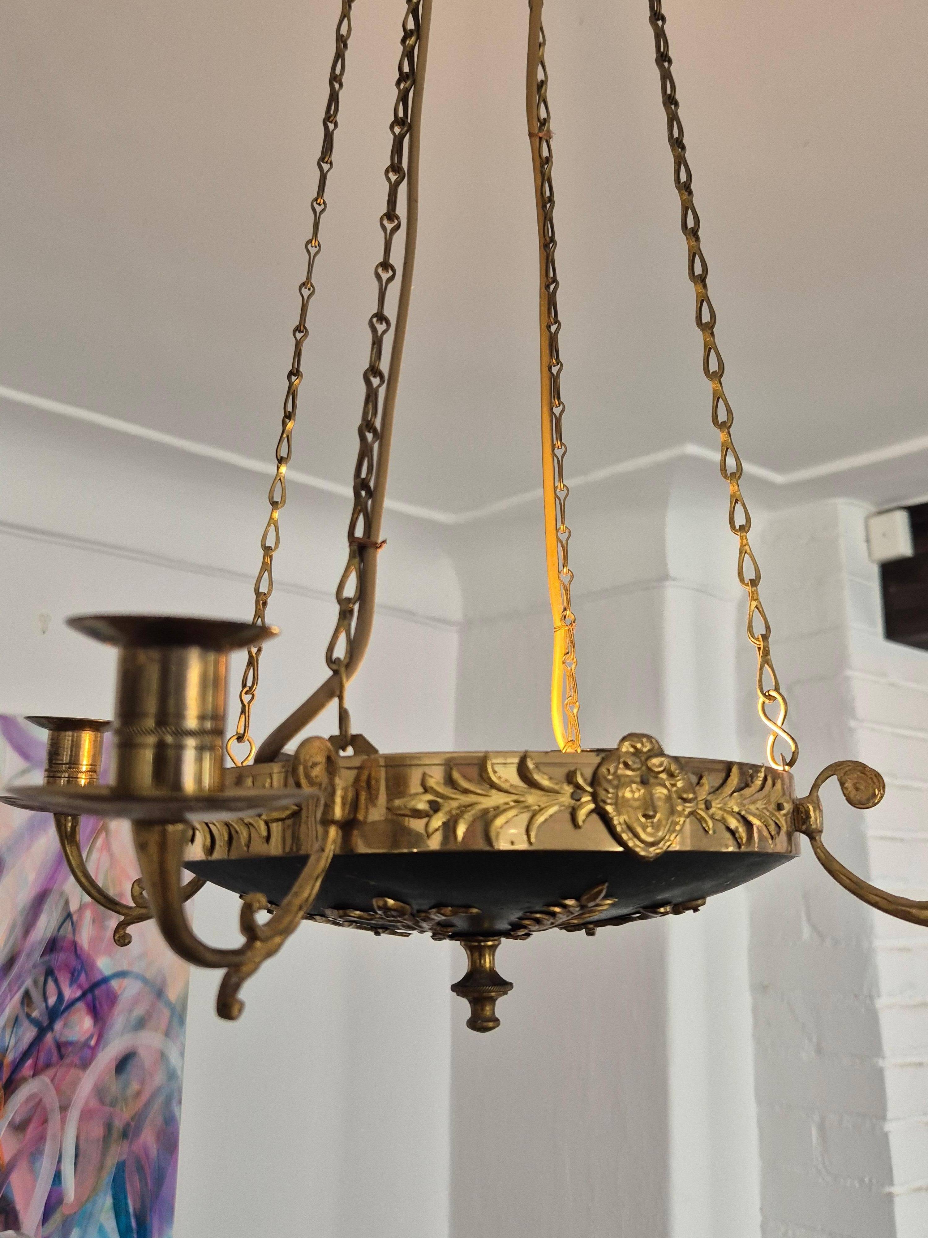Pendant in brass with two light sockets and four candle holders, Empire style