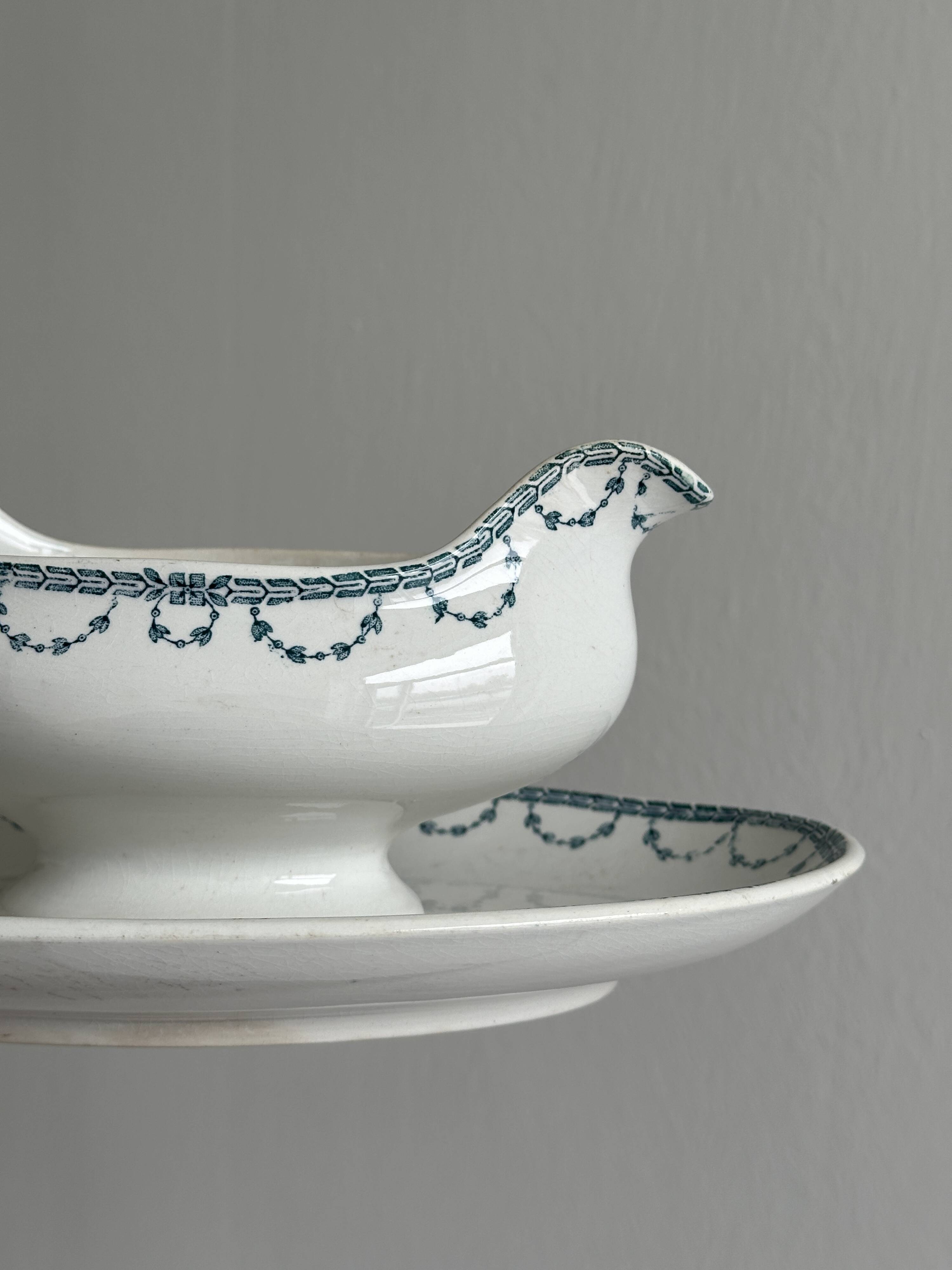 Antique porcelain sauceboat with tray