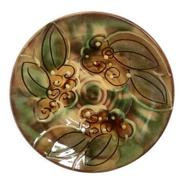 Ceramic catchall with flowers, fruits, and leaves.
