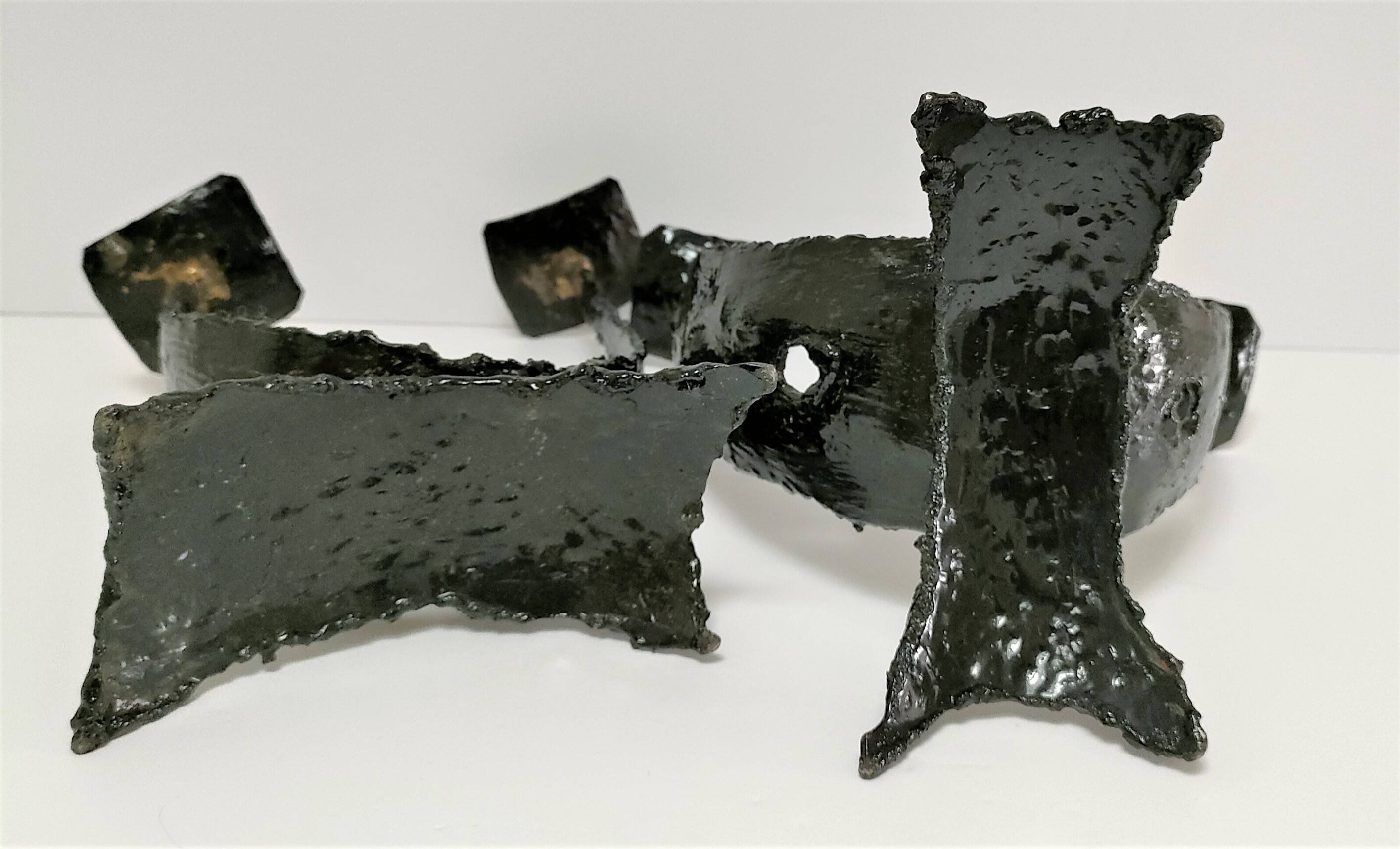 Pair of brutalist design metal candlesticks