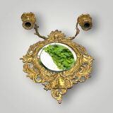 Antique bronze wall sconce with two candlesticks and beveled mirror