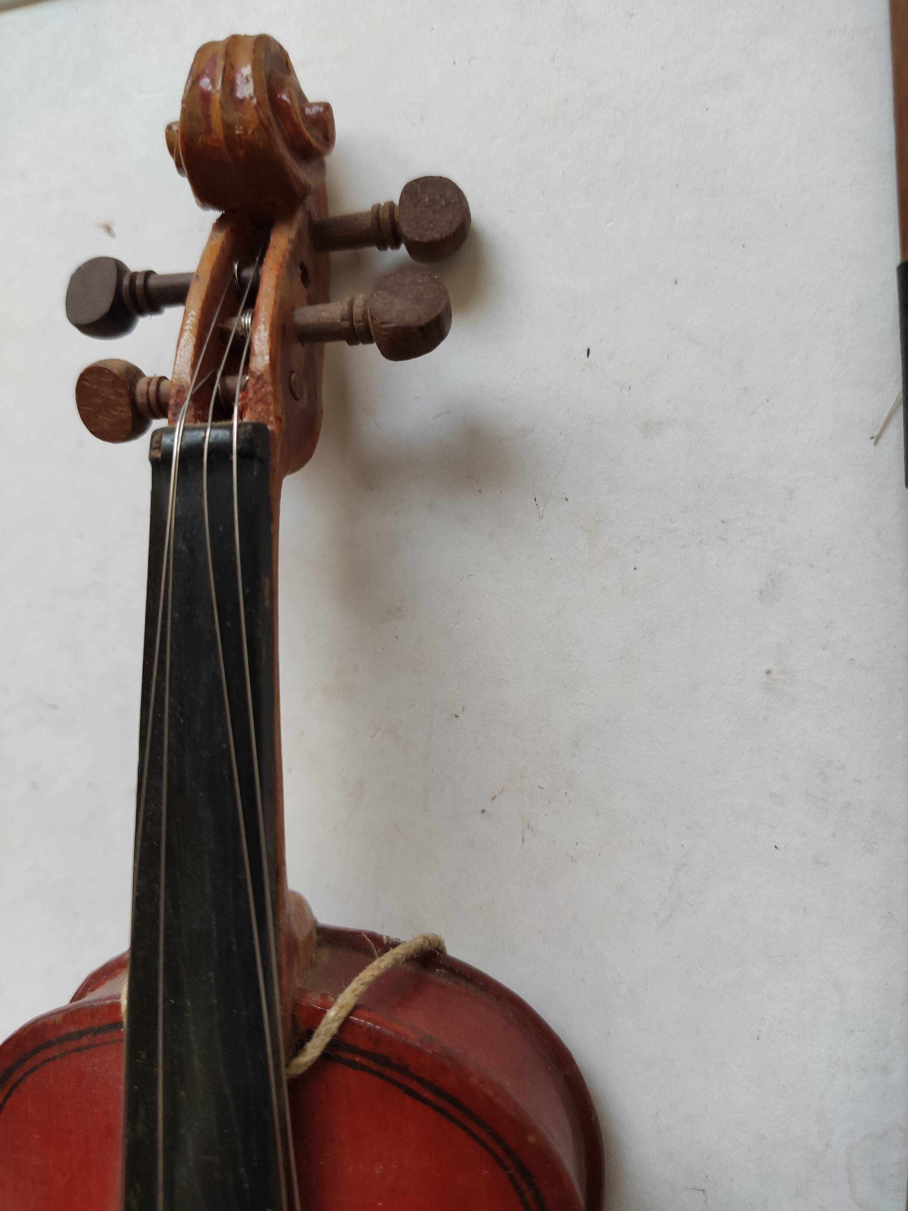 violin and decorative archer in antique varnished wood